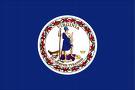 The flag of Virginia features a blue background with a circular seal depicting a female figure, surrounded by a wreath.